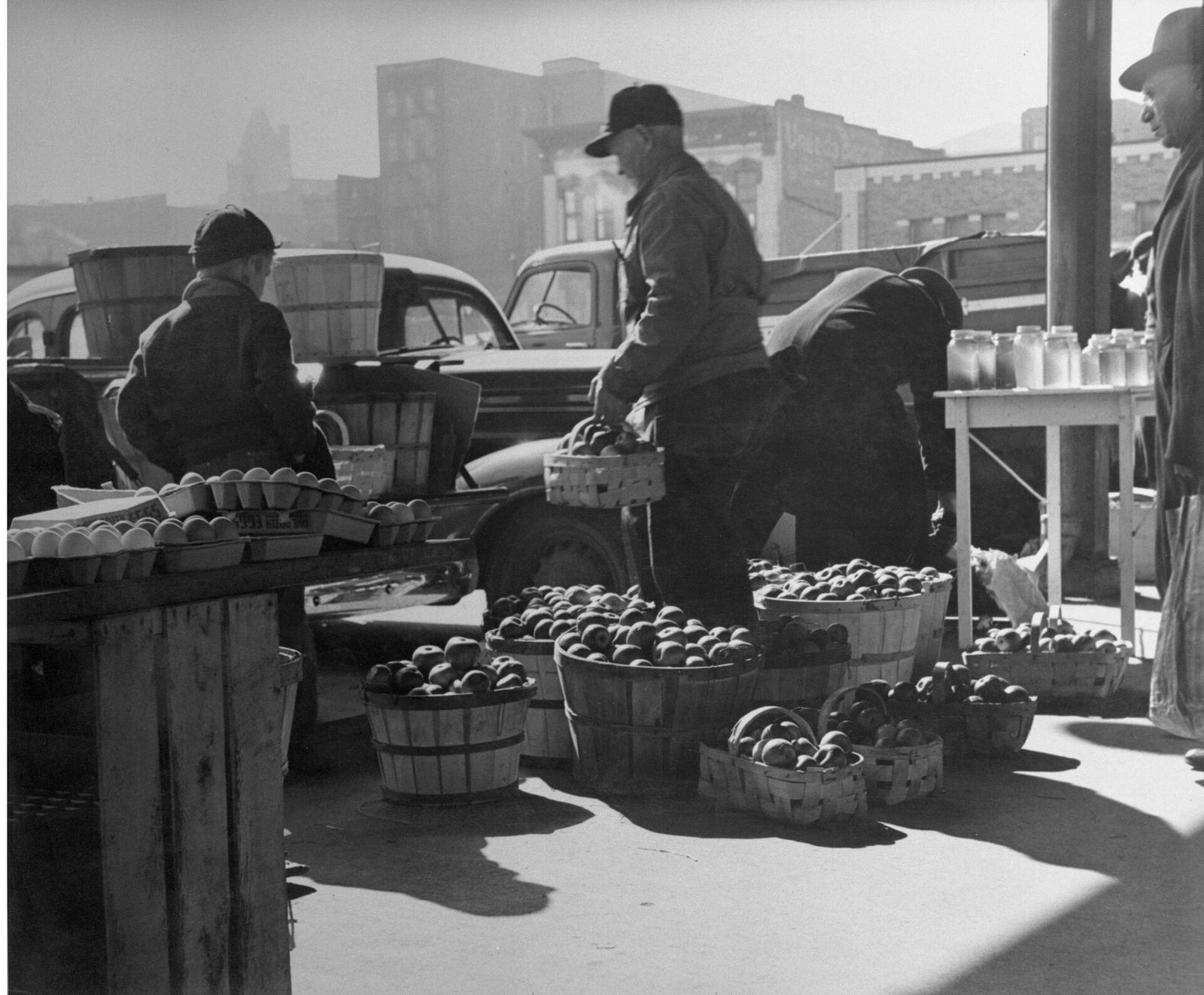Farmers unload produce at City Market